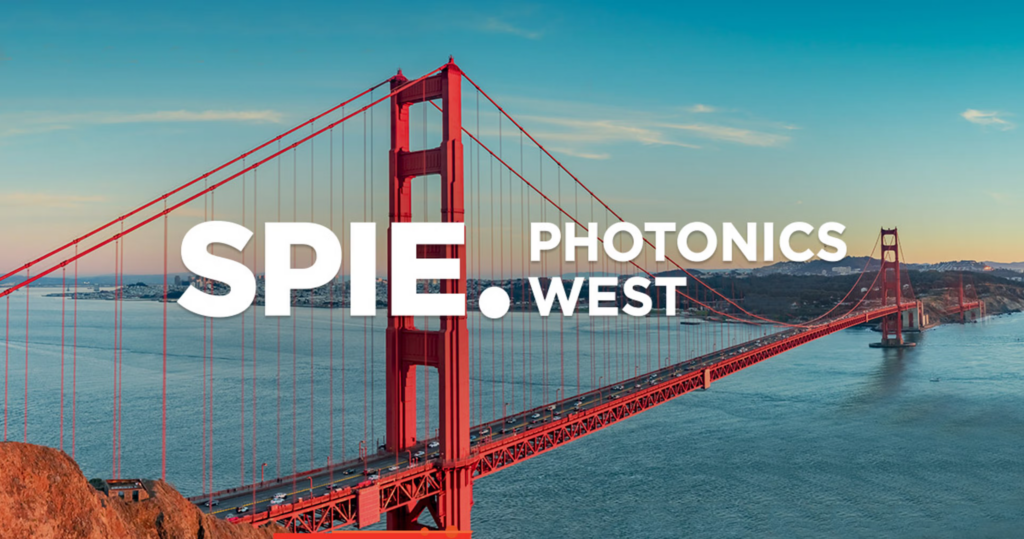 Golden gate bridge at sunrise with the words "SPIE Photonics West" Laid over the top 