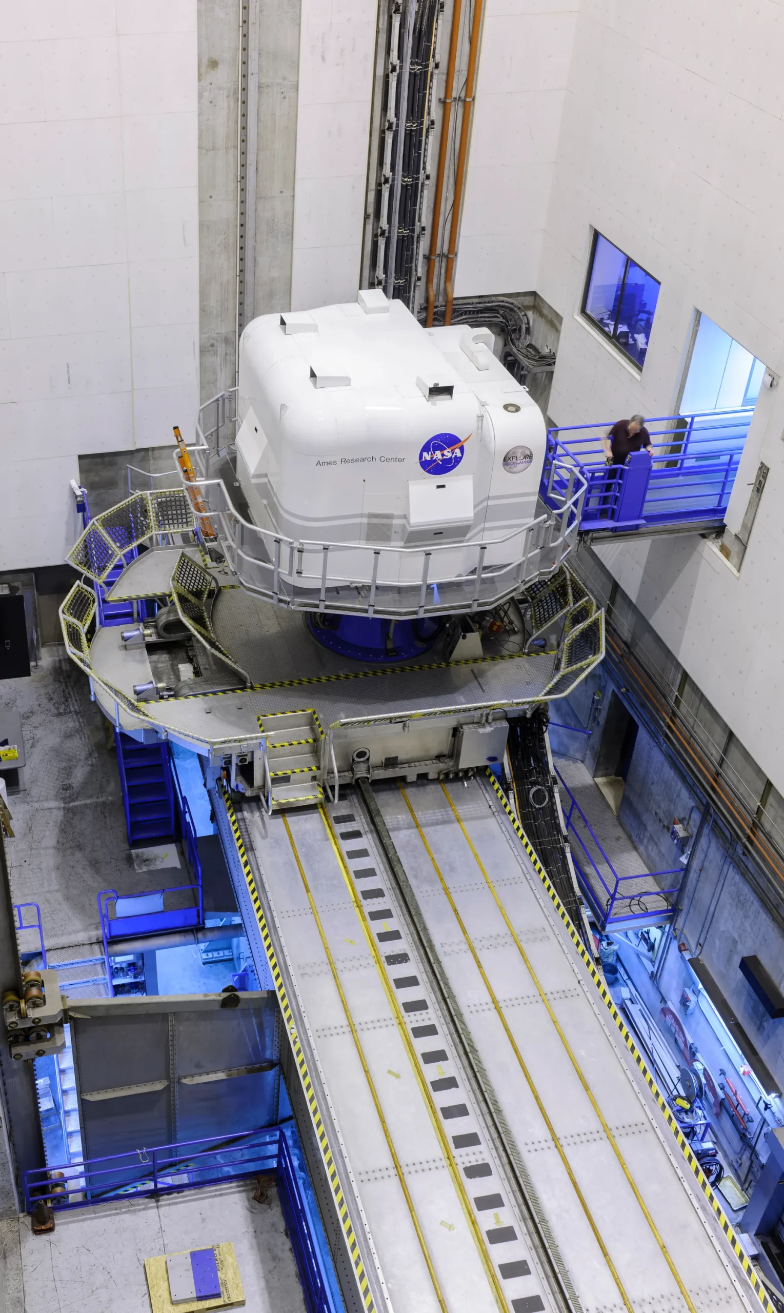 aerial view of a closed simulation system inside of a large warehouse
