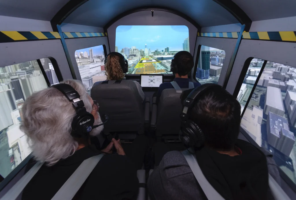 view from inside the cockpit of a simulator with 4 occupants
